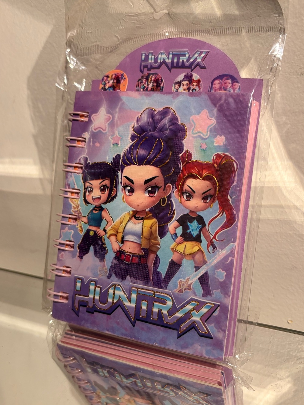 Kpop demon hunters mini sparkly notebook.